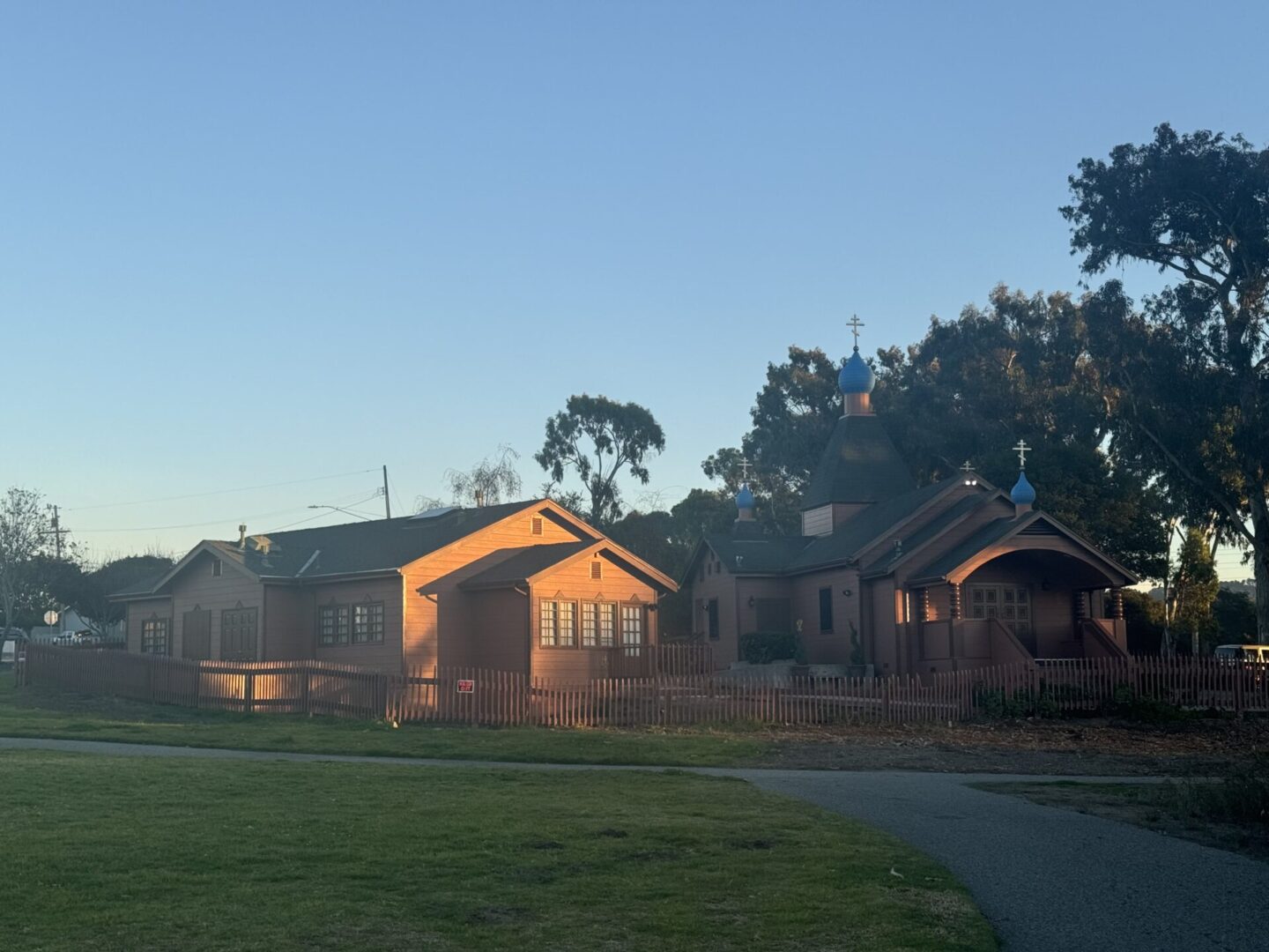 A group of houses in the middle of a field.