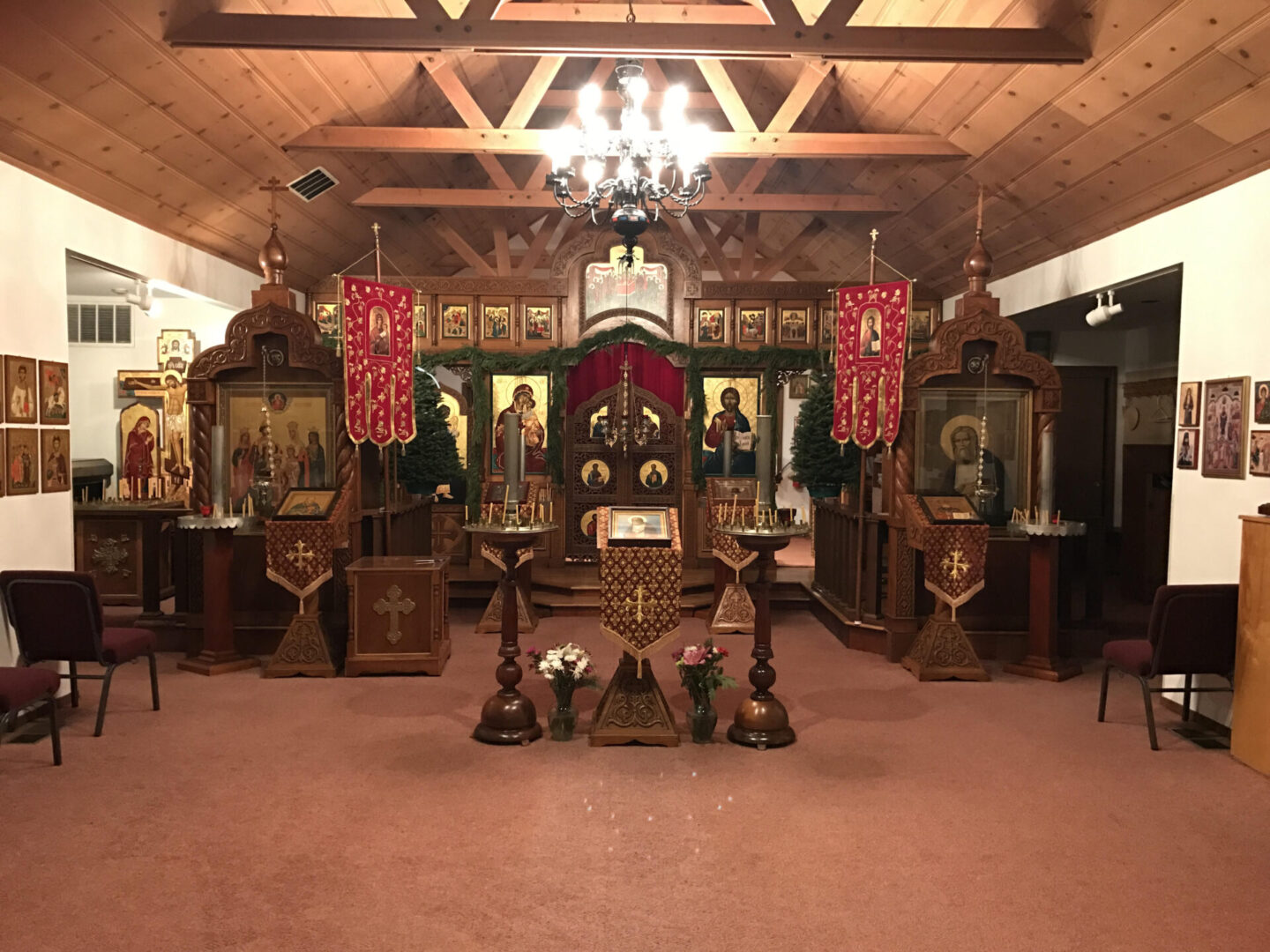 A large room with many wooden furniture and paintings.